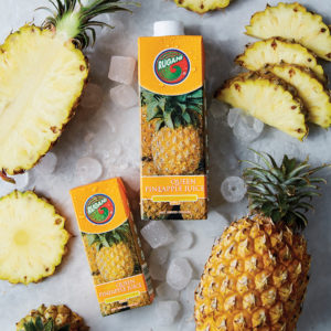 Rugani Juice 100% Queen pineapple juice series on ice with pineapple garnish